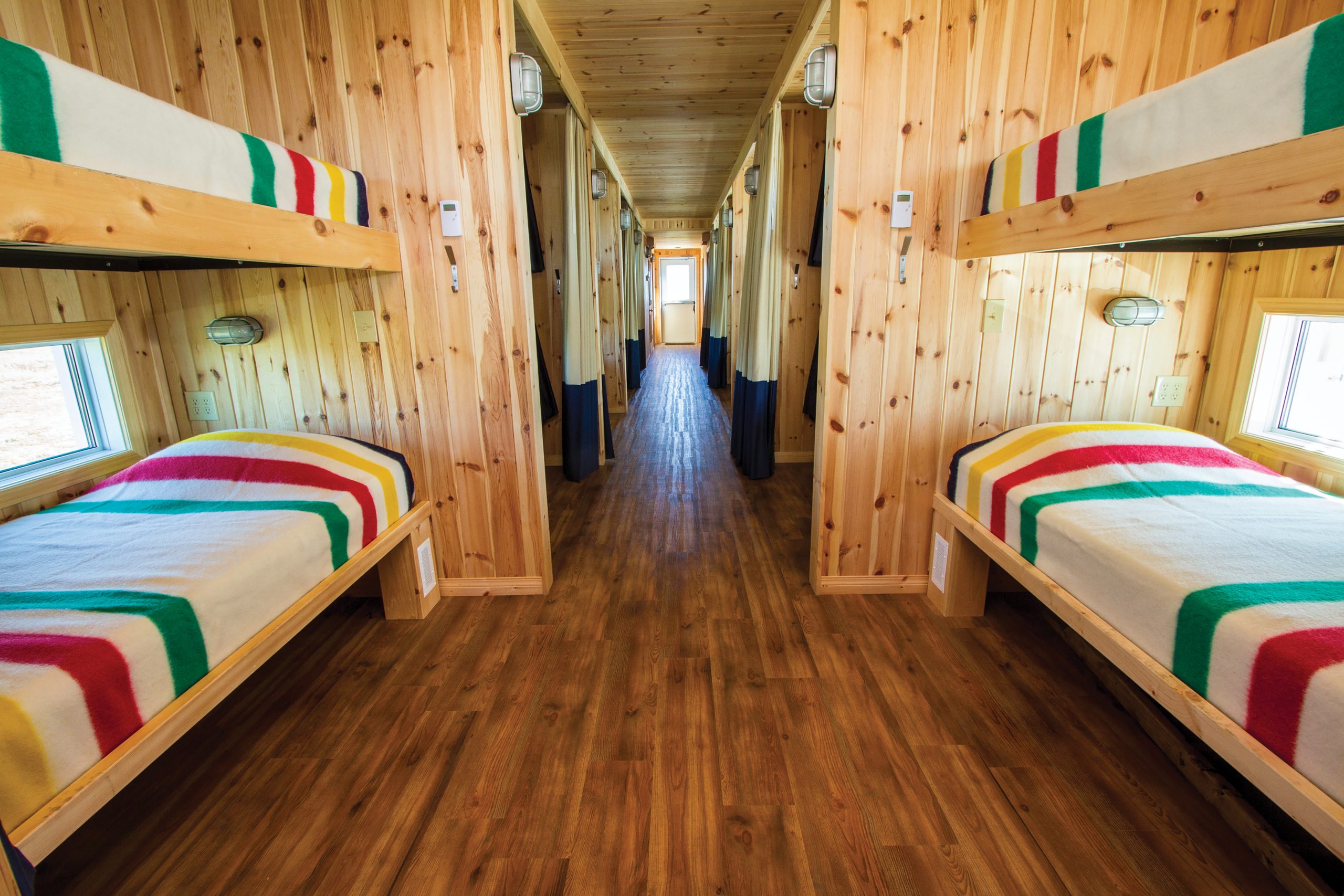 Crediting is required when using Frontiers North's photos. This means you have to credit both the photographer and Frontiers North Adventures using the following convention: © Photographer's Name/Frontiers North Adventures.
Image Caption:
The sleeping accommodations at the Tundra Buggy Lodge. Each sleeping berth has its own window, a reading light, four 110-volt electrical outlets and a sound-dampening curtain for privacy.