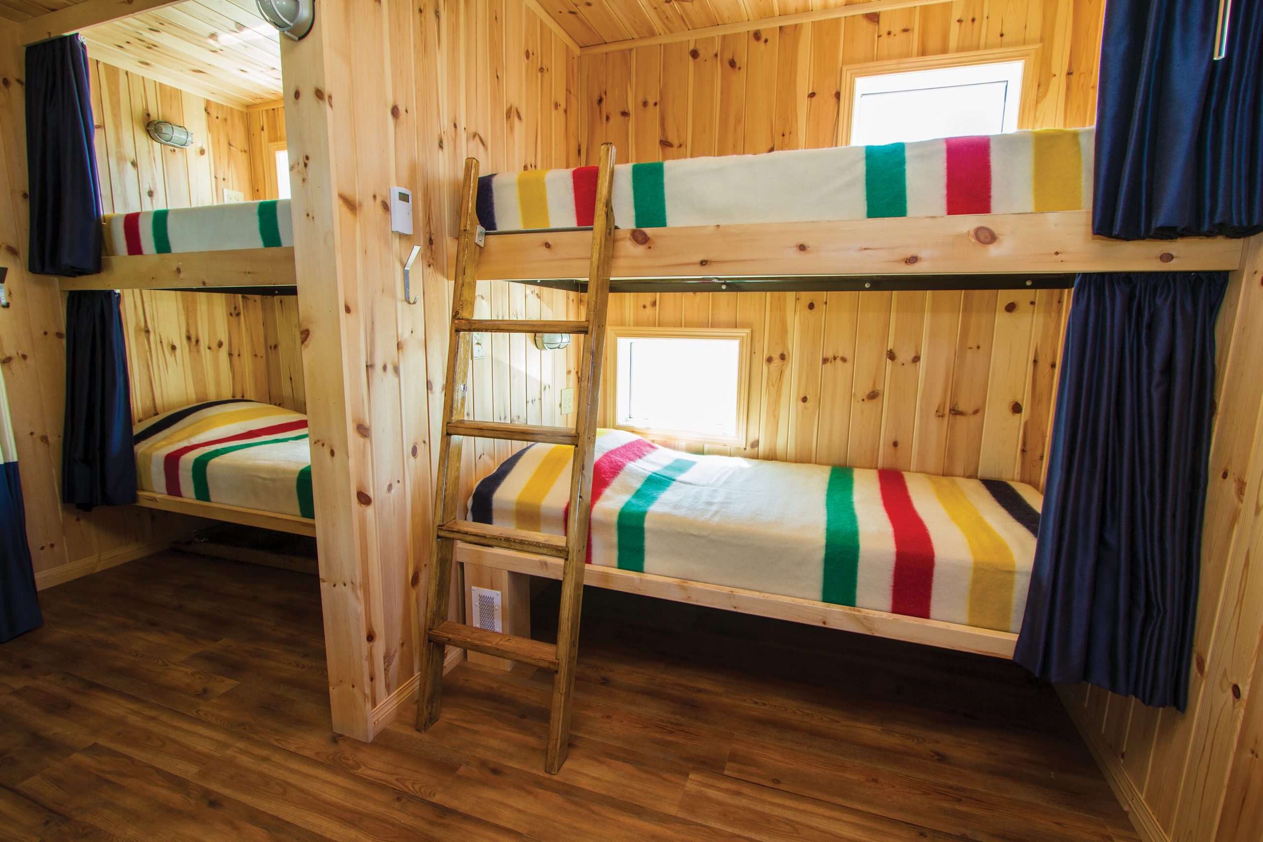 Crediting is required when using Frontiers North's photos. This means you have to credit both the photographer and Frontiers North Adventures using the following convention: © Photographer's Name/Frontiers North Adventures.
Image Caption:
The sleeping accommodations at the Tundra Buggy Lodge. Each sleeping berth has its own window, a reading light, four 110-volt electrical outlets and a sound-dampening curtain for privacy.